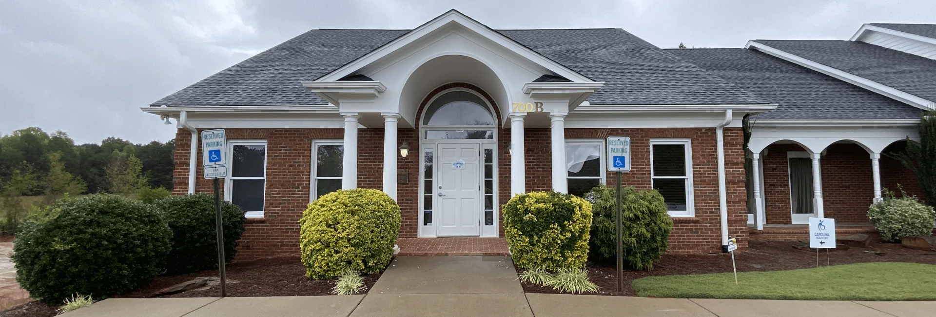 brown house with gray roof